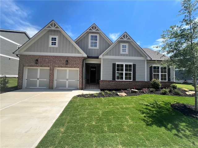 craftsman house with a front lawn and a garage