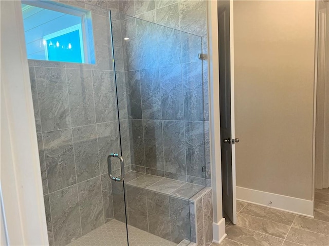 bathroom with a shower with shower door