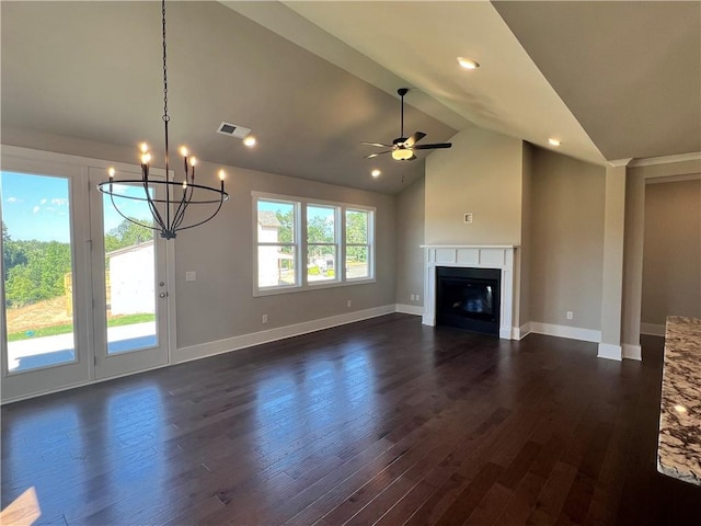 unfurnished living room with ceiling fan with notable chandelier, lofted ceiling, and dark wood-type flooring