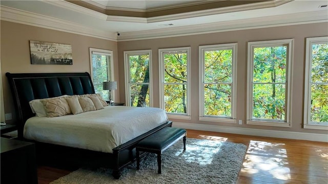 5993 Overby Rd, Flowery Branch, GA 30542 - bedroom with crown molding, wood finished floors, and baseboards