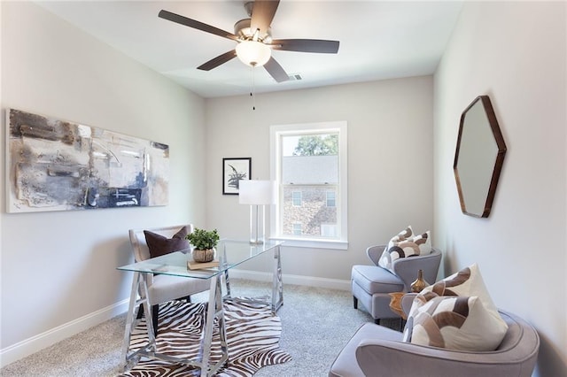 home office with light carpet, ceiling fan, visible vents, and baseboards