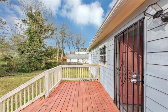 wooden terrace with a yard