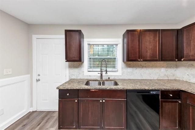 kitchen featuring light wood-type flooring, a sink, light stone counters, dark brown cabinetry, and dishwasher