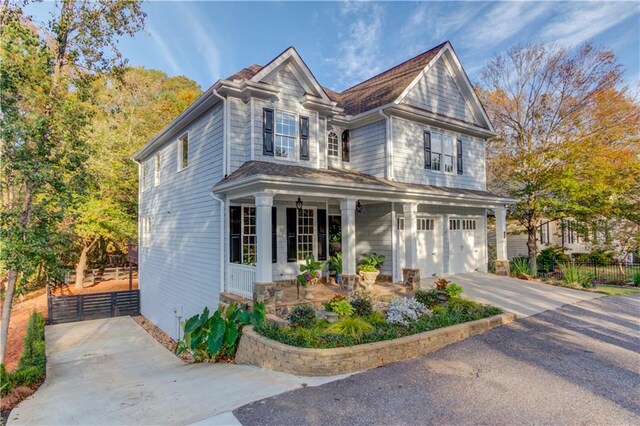 view of front of home with a garage and a porch