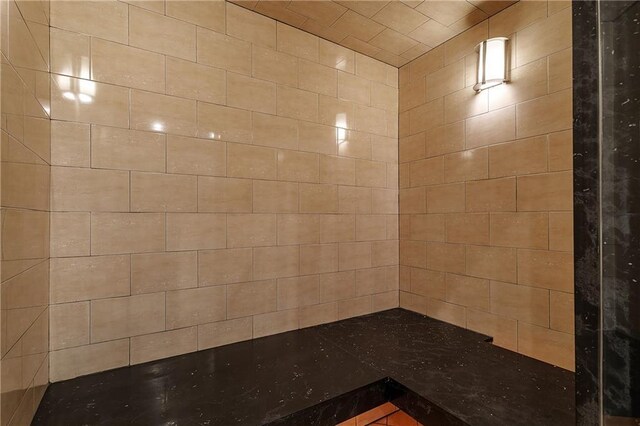 interior space featuring a tile shower
