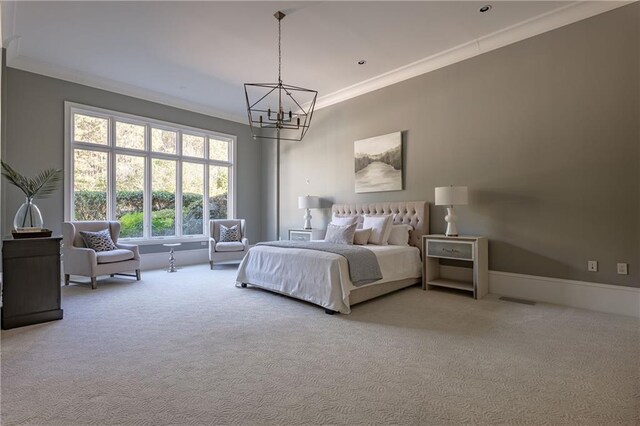 bedroom featuring an inviting chandelier, baseboards, ornamental molding, and carpet
