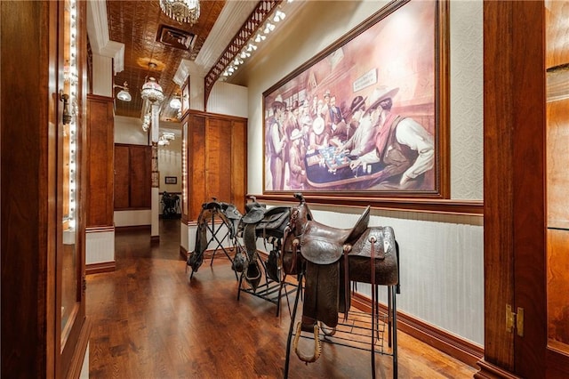 dining area featuring an ornate ceiling, ornate columns, wood finished floors, and wallpapered walls