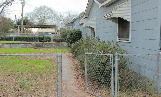 view of yard featuring a gate and fence