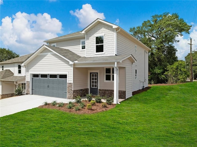 front facade featuring a garage and a front lawn