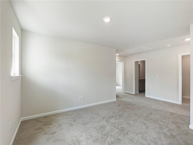 empty room featuring light colored carpet