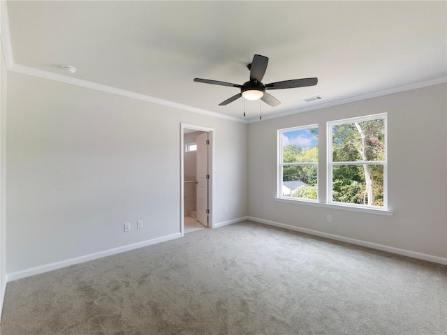 unfurnished room with light carpet, ceiling fan, and ornamental molding