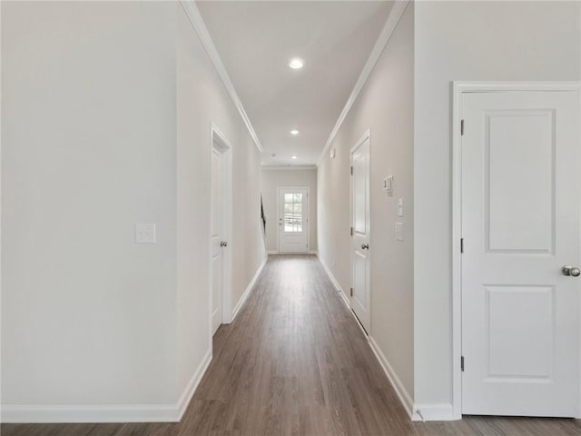 corridor featuring hardwood / wood-style floors and ornamental molding