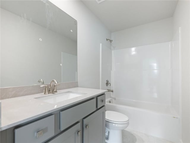 full bathroom featuring tile patterned floors, vanity, toilet, and bathtub / shower combination