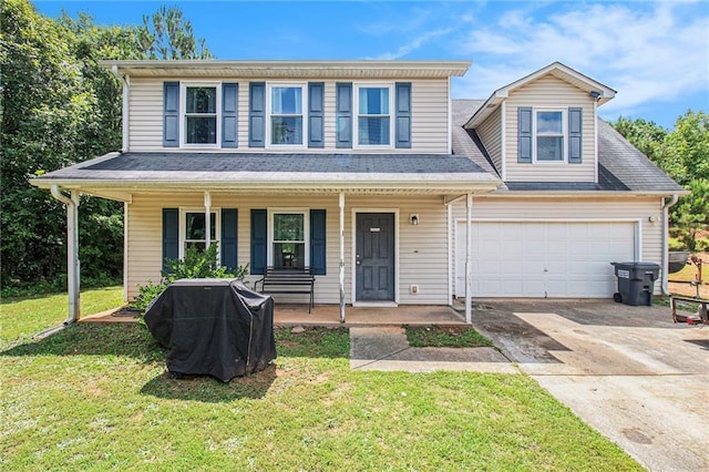 45 Ratliff Dr, Covington, GA 30016 - view of front of home with covered porch, concrete driveway, and a front lawn
