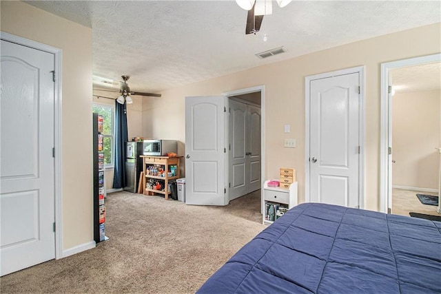 45 Ratliff Dr, Covington, GA 30016 - bedroom featuring carpet flooring, a textured ceiling, and ceiling fan