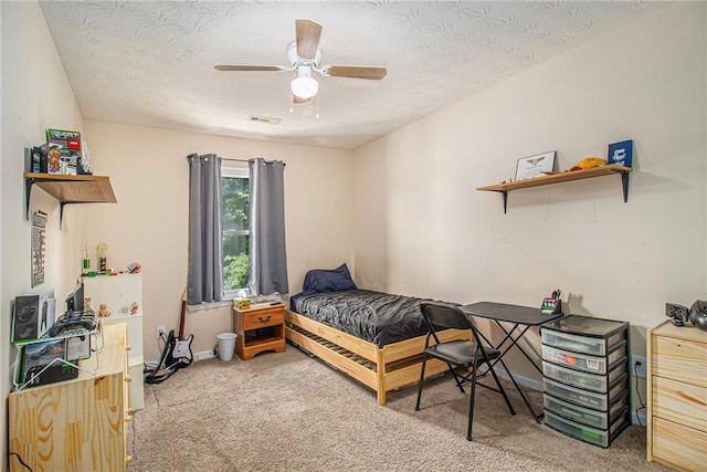 45 Ratliff Dr, Covington, GA 30016 - bedroom featuring light colored carpet, a ceiling fan, and a textured ceiling