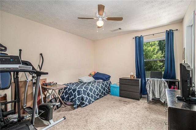 45 Ratliff Dr, Covington, GA 30016 - bedroom with carpet, a textured ceiling, and ceiling fan