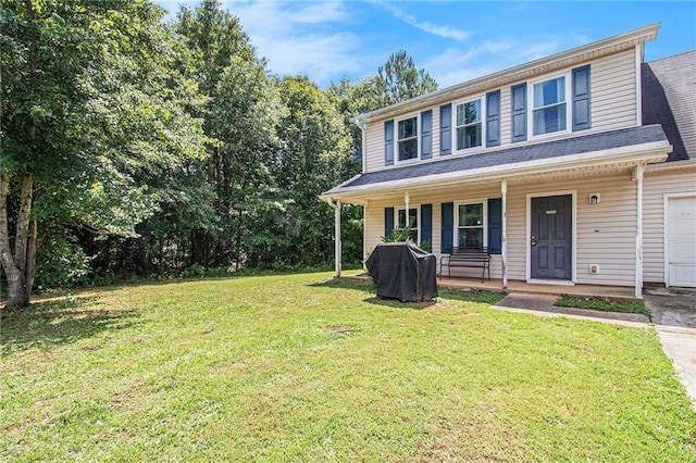 45 Ratliff Dr, Covington, GA 30016 - view of front of property featuring covered porch, a front lawn, a garage, and driveway