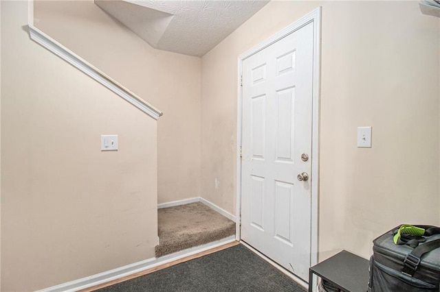 45 Ratliff Dr, Covington, GA 30016 - doorway to outside featuring carpet flooring and a textured ceiling