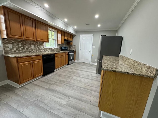 kitchen featuring range with gas stovetop, dishwasher, crown molding, backsplash, and freestanding refrigerator