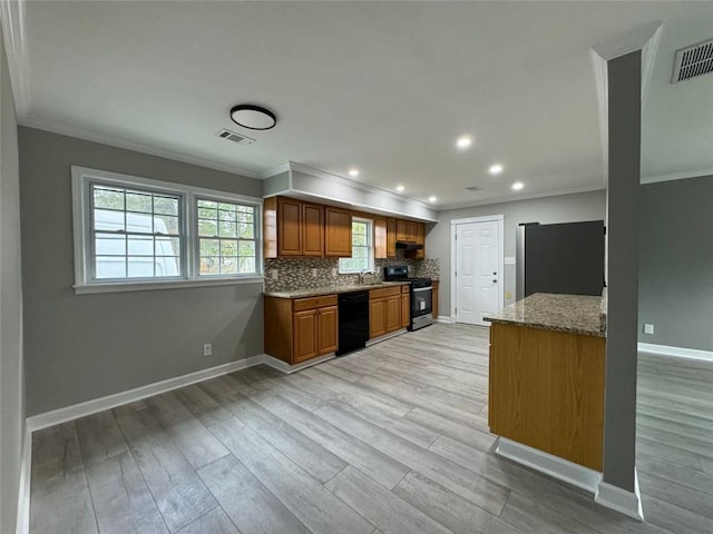 kitchen featuring gas stove, dishwasher, crown molding, fridge, and baseboards