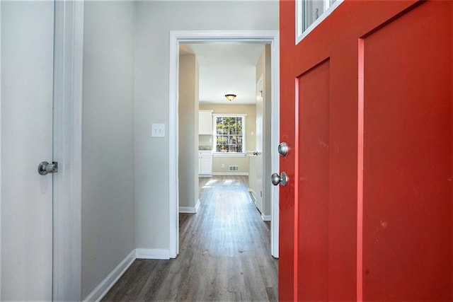 hallway featuring wood-type flooring