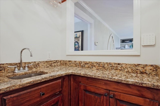 bathroom with vanity and ornamental molding