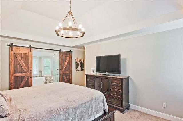 bedroom featuring a notable chandelier, a barn door, baseboards, a raised ceiling, and light colored carpet