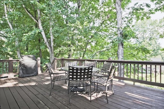 wooden deck with outdoor dining area