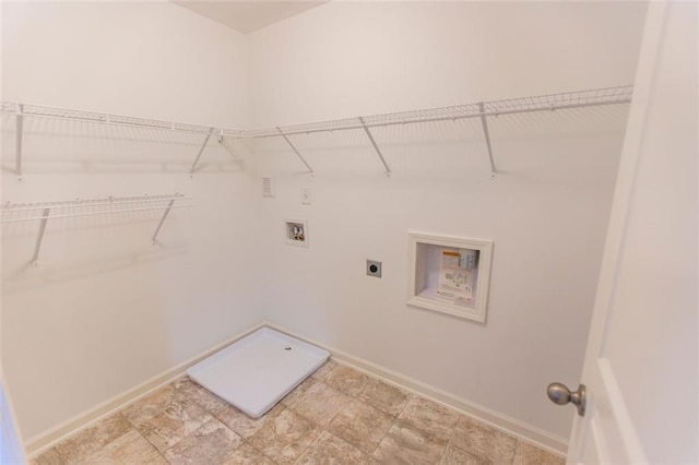 laundry area featuring hookup for an electric dryer, hookup for a washing machine, and baseboards
