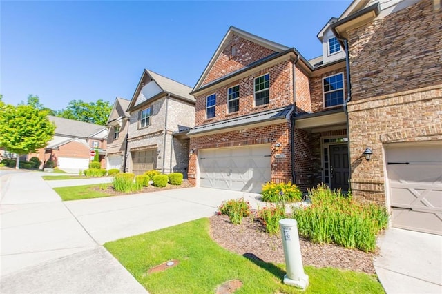 view of front of home with brick siding, a garage, and concrete driveway