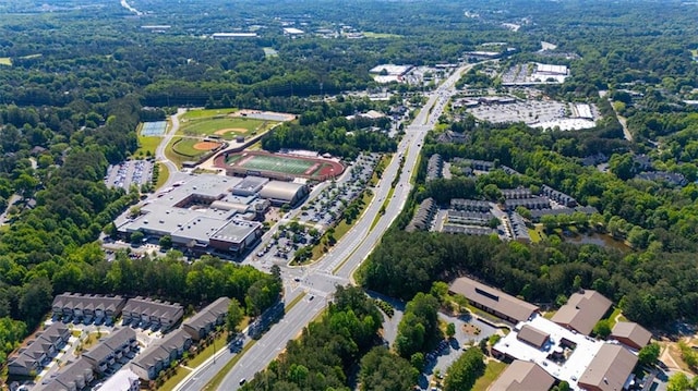 aerial overview of property's location with a heavily wooded area