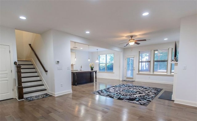 entryway with ceiling fan, wood finished floors, baseboards, and recessed lighting