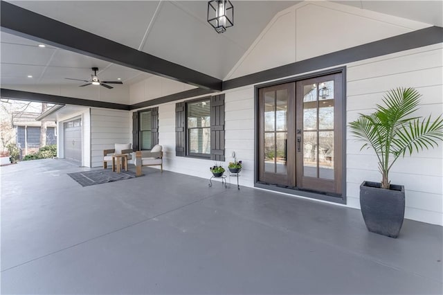 view of patio / terrace with french doors, ceiling fan, and a garage