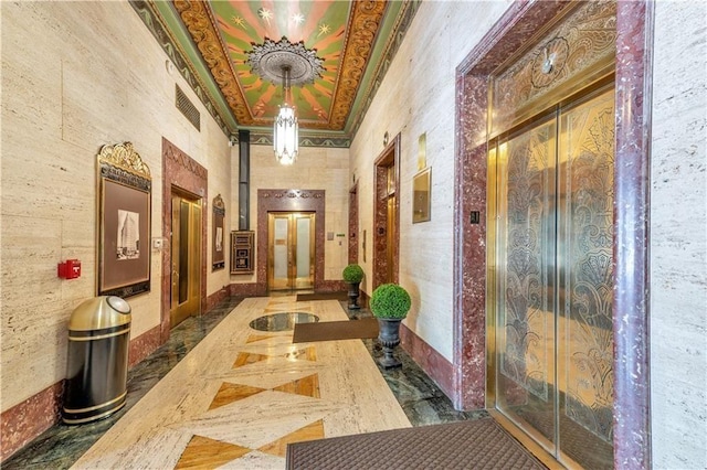 hall featuring elevator and crown molding