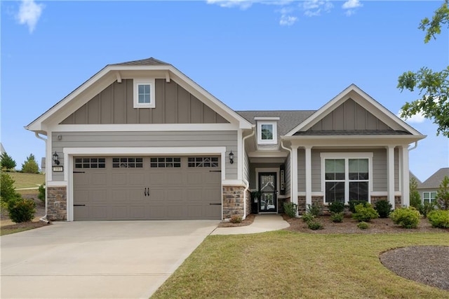 craftsman-style house featuring a front lawn and a garage