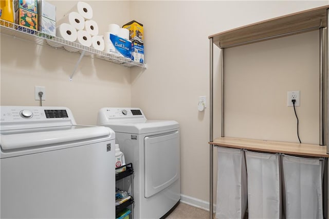 laundry room with independent washer and dryer