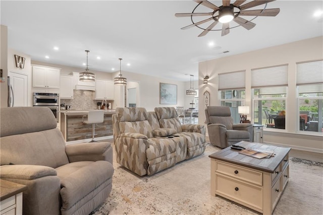 living room with ceiling fan