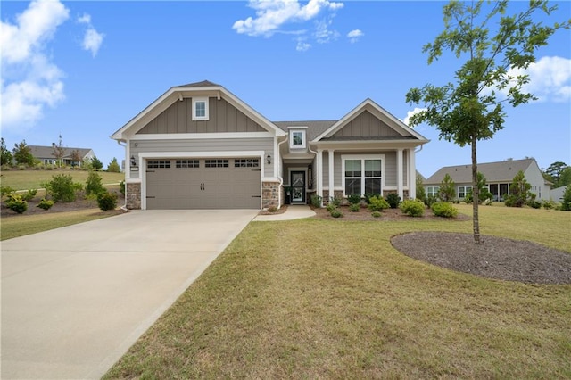 craftsman-style house with a front yard and a garage