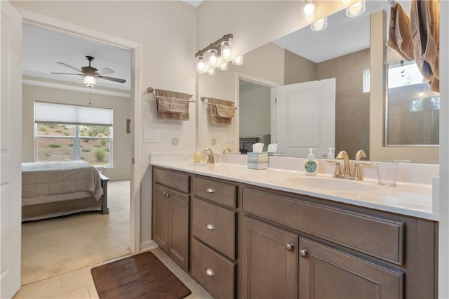 bathroom with tile patterned flooring, ceiling fan, and vanity