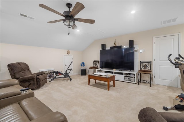 living room featuring ceiling fan, light colored carpet, and lofted ceiling