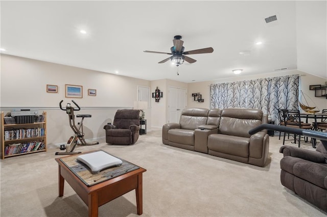 living room featuring light carpet and ceiling fan