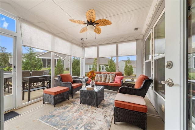 sunroom / solarium featuring ceiling fan