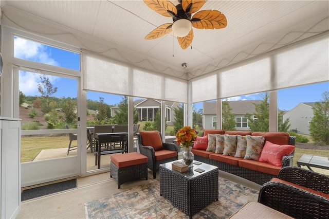 sunroom / solarium with ceiling fan and plenty of natural light