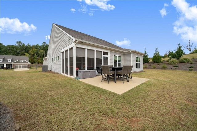 rear view of house featuring cooling unit, a patio area, and a yard