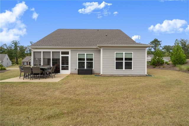 back of house featuring a yard and a patio area