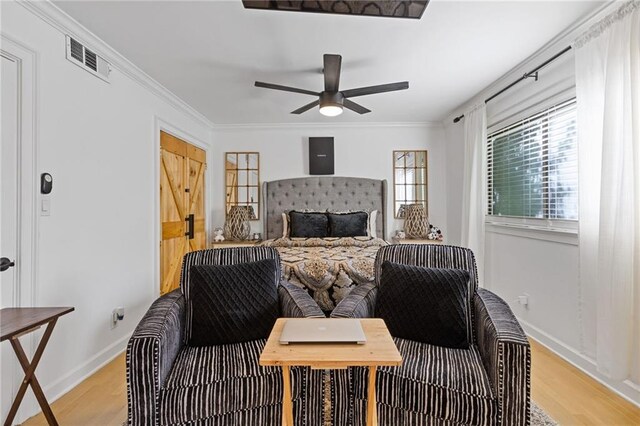 10 26th St NW Unit A2, Atlanta, GA 30309 - bedroom featuring baseboards, crown molding, light wood-style floors, and visible vents