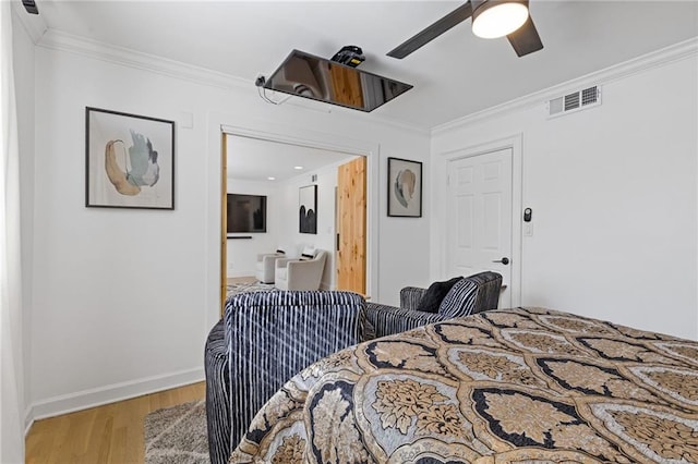 10 26th St NW Unit A2, Atlanta, GA 30309 - bedroom with baseboards, light wood-style flooring, visible vents, and crown molding