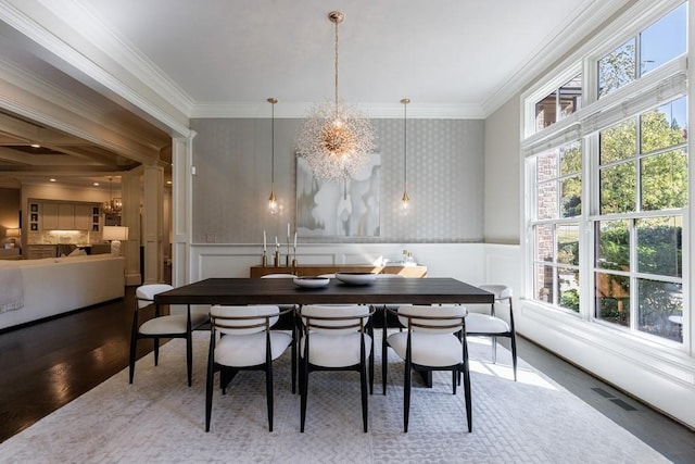 9675 Almaviva Dr, Alpharetta, GA 30022 - dining area featuring a chandelier, a decorative wall, ornamental molding, wood finished floors, and wallpapered walls