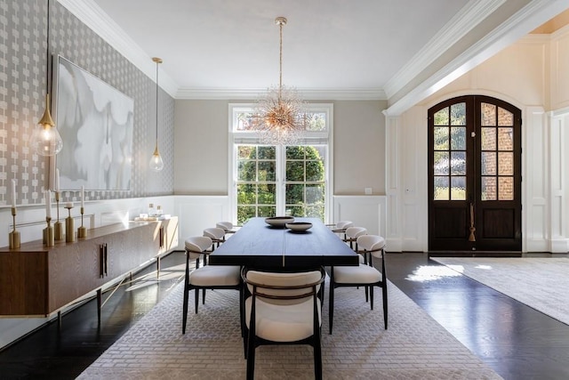 9675 Almaviva Dr, Alpharetta, GA 30022 - dining space featuring a decorative wall, a chandelier, ornamental molding, wood finished floors, and wainscoting